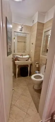 a bathroom with a toilet and a sink at 1 bedroom Harmony Monte Carlo in Sunny Beach