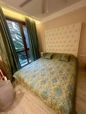 a bedroom with a bed with a large window at 1 bedroom Harmony Monte Carlo in Sunny Beach