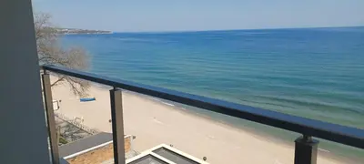 a view of the beach from a balcony at Magic Home in Obzor
