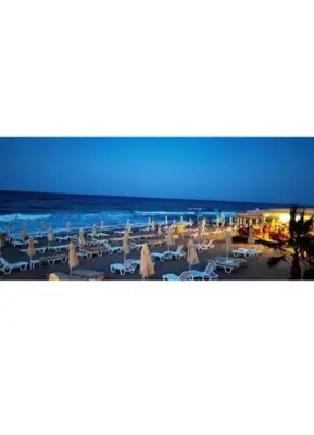 a view of a beach with umbrellas and the ocean at Magic Home in Obzor