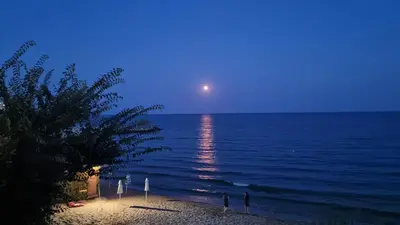 a moonrise over the ocean at a beach at night at Apartment mit Meeresblick Polarstar Beach 2 Zimmer Premium Apartment in Sveti Vlas