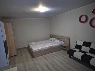 a small bedroom with a bed and a couch at Luxury Apartments Central KIRIL I METODII 3 in Burgas City