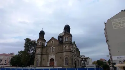 an old building with two domes on top of it at Luxury Apartments Central KIRIL I METODII 3 in Burgas City