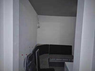 a small room with a chair and a table at Luxury Apartments Central KIRIL I METODII 3 in Burgas City