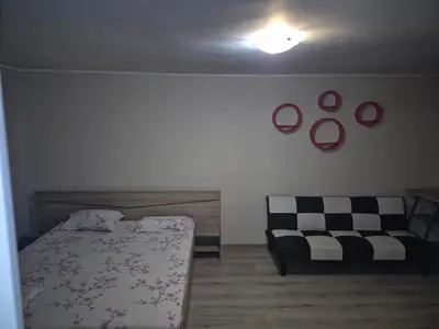 a bedroom with a bed and a couch at Luxury Apartments Central KIRIL I METODII 3 in Burgas City