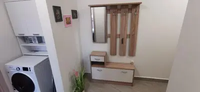 a room with a washing machine and a mirror at Ах, морето 2 in Burgas City