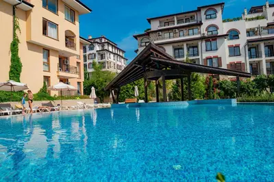 a large swimming pool in front of some buildings at Paradise Dreams Menada Apartments in Sveti Vlas