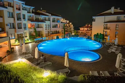 a large swimming pool in the middle of a building at Paradise Dreams Menada Apartments in Sveti Vlas