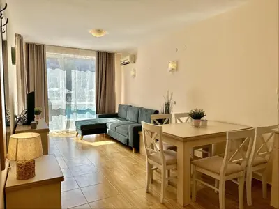 a living room with a couch and a table at Paradise Dreams Menada Apartments in Sveti Vlas
