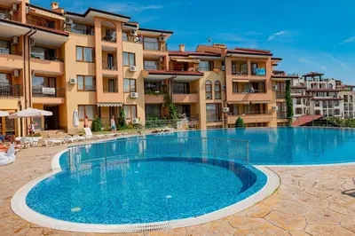 a large swimming pool in front of a building at Paradise Dreams Menada Apartments in Sveti Vlas