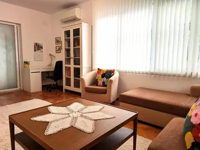 a living room with a coffee table and a living room with at Seaside luxury residence in Varna City