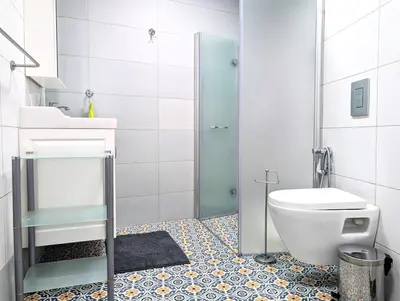 a bathroom with a toilet and a sink and a shower at Seaside luxury residence in Varna City