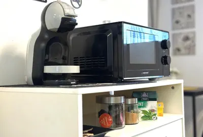 a microwave oven sitting on top of a counter at Studio Sea Garden in Varna City