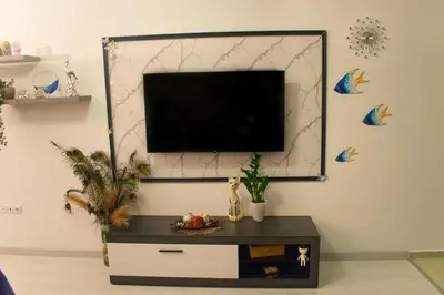 a living room with a tv on a wall at Nelly's Place 10 in Shkorpilovtsi