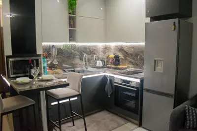 a kitchen with a sink and a counter top at Nelly's Place 10 in Shkorpilovtsi