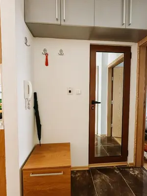 a room with a door and a mirror on the wall at Smile City Apartment in Varna City