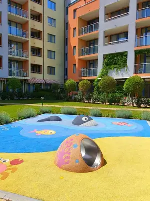 a computer mouse on the ground in front of a building at Trakia Plaza Apartments in Sunny Beach