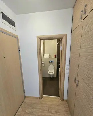 a bathroom with a toilet in a room at Двустаен апартамент Поморие in Pomorie