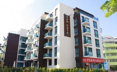 a large building with a sign on the side of it at SUN GATE - Julia in Sunny Beach