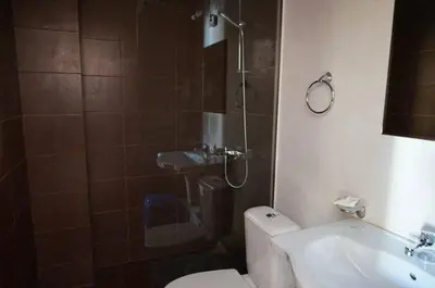 a bathroom with a shower and a toilet and a sink at SUN GATE - Kamil in Sunny Beach