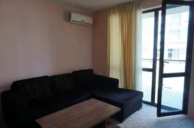 a living room with a couch and a coffee table at SUN GATE - Kamil in Sunny Beach