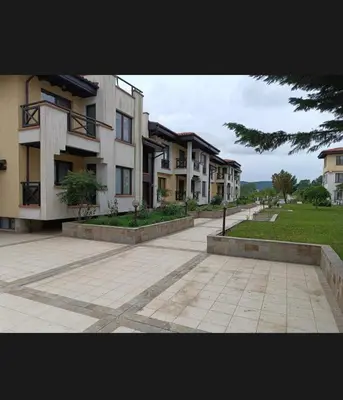 a row of apartment buildings on a street at Relaxing apartment - 100 meters from the sea in Chernomorets