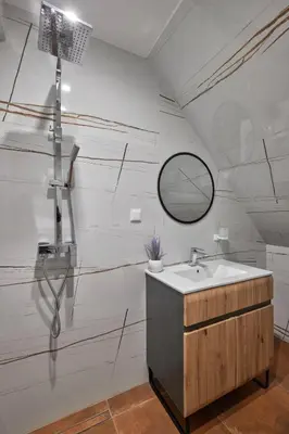 a bathroom with a sink and a mirror at MAESTRA Bamboo Beach Luxury Apartment - FREE Parking in Sozopol