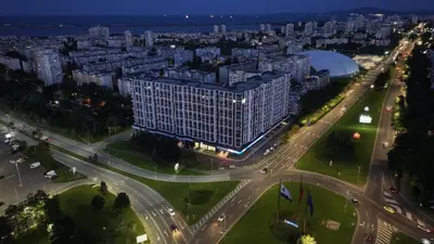 an aerial view of a city at night at Арена Изгрев in Burgas City