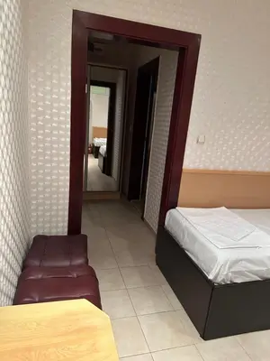 a bedroom with a bed and a mirror in it at Miramar Apartment in Sunny Beach