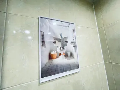 a shower with a glass door in a bathroom at Glarus in Varna City