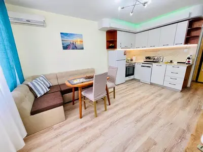 a living room with a couch and a table at Glarus in Varna City