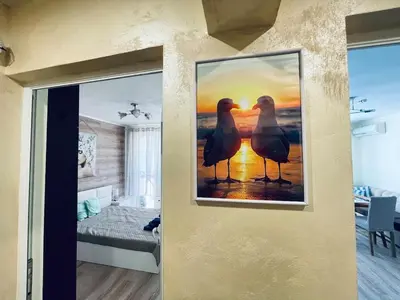 a picture of two birds on a wall at Glarus in Varna City