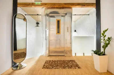 a glass door in a room with a rug on the floor at Apartment Musala N 02 in Varna City