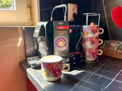 a counter top with a cup of coffee and a toaster at Villa Teos in Novo Panicharevo
