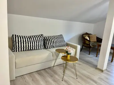 a living room with a couch and a table at Villa Teos in Novo Panicharevo