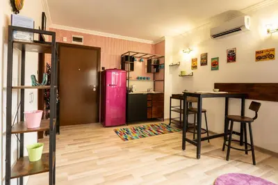 a kitchen with a pink refrigerator in a room at Zen Studio - Oasis Beach Club in Lozenets
