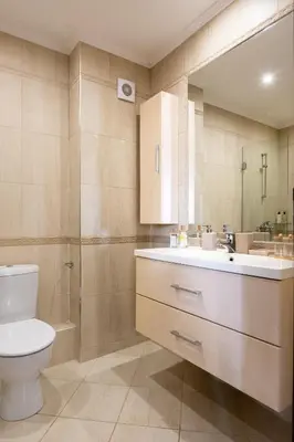 a bathroom with a toilet and a sink and a shower at Zen Studio - Oasis Beach Club in Lozenets