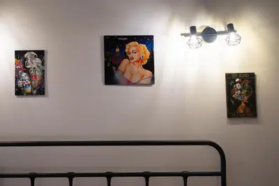 a room with three pictures on a white wall at Zen Studio - Oasis Beach Club in Lozenets