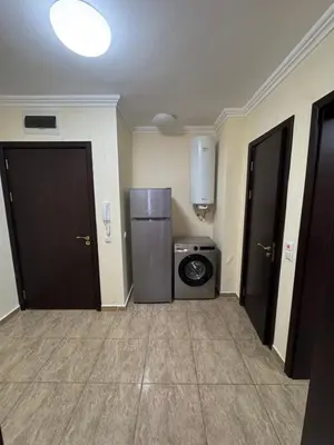 a room with a refrigerator and a washing machine at Private Apartments Olymp in Sveti Vlas