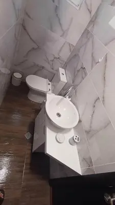 a bathroom with a white sink and a toilet at Синя пеперуда Blue butterfly in Primorsko