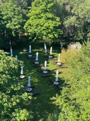 a group of statues sitting in the grass at Santa Marina Sun&Sea Haven in Sozopol