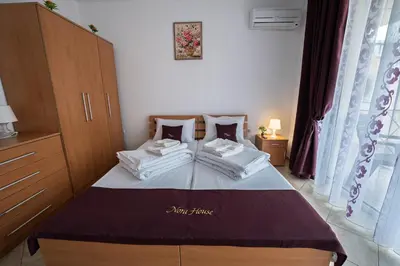 a bedroom with a bed with two pillows at Apartment NORA in Sunny Beach