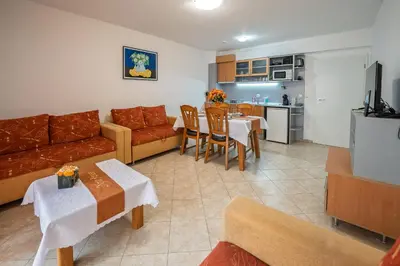 a living room with a couch and a table at Apartment NORA in Sunny Beach