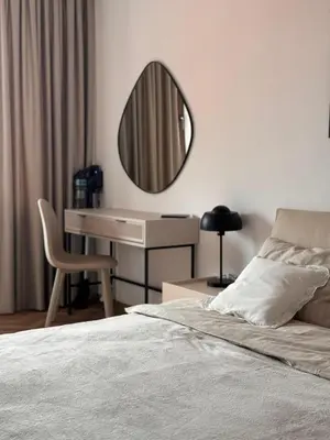 a bedroom with a bed with a desk and a mirror at SeaView Etara IV Apartment in Sveti Vlas in Sveti Vlas