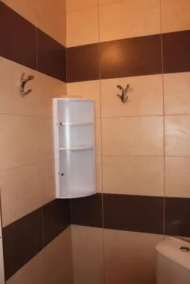 a bathroom with two birds on the wall at Megi Apartments in Sozopol