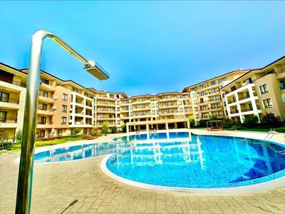 a large swimming pool in front of a apartment building at Menada Sea Dreams Apartments in Sveti Vlas