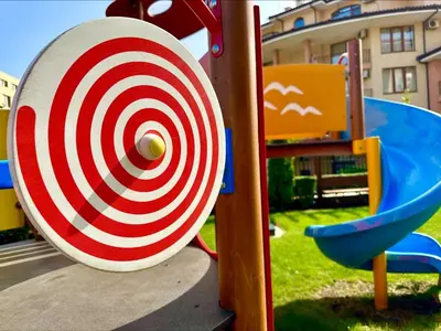 a red and white target on a playground at Menada Sea Dreams Apartments in Sveti Vlas