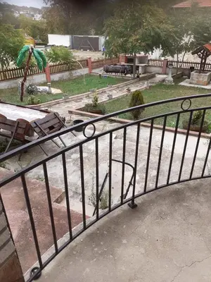 a metal railing with a park in the background at Sunshine in Byala