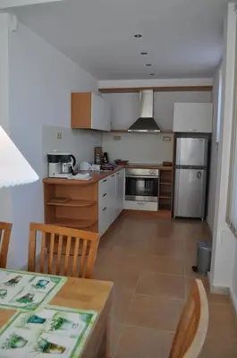 a kitchen with a table and a counter top at Villa Sun Village Byala in Byala
