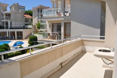 a balcony with a sink and a swimming pool at Villa Sun Village Byala in Byala